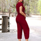 Blauwe jumpsuit met knoopsluiting en ceintuur - Emma