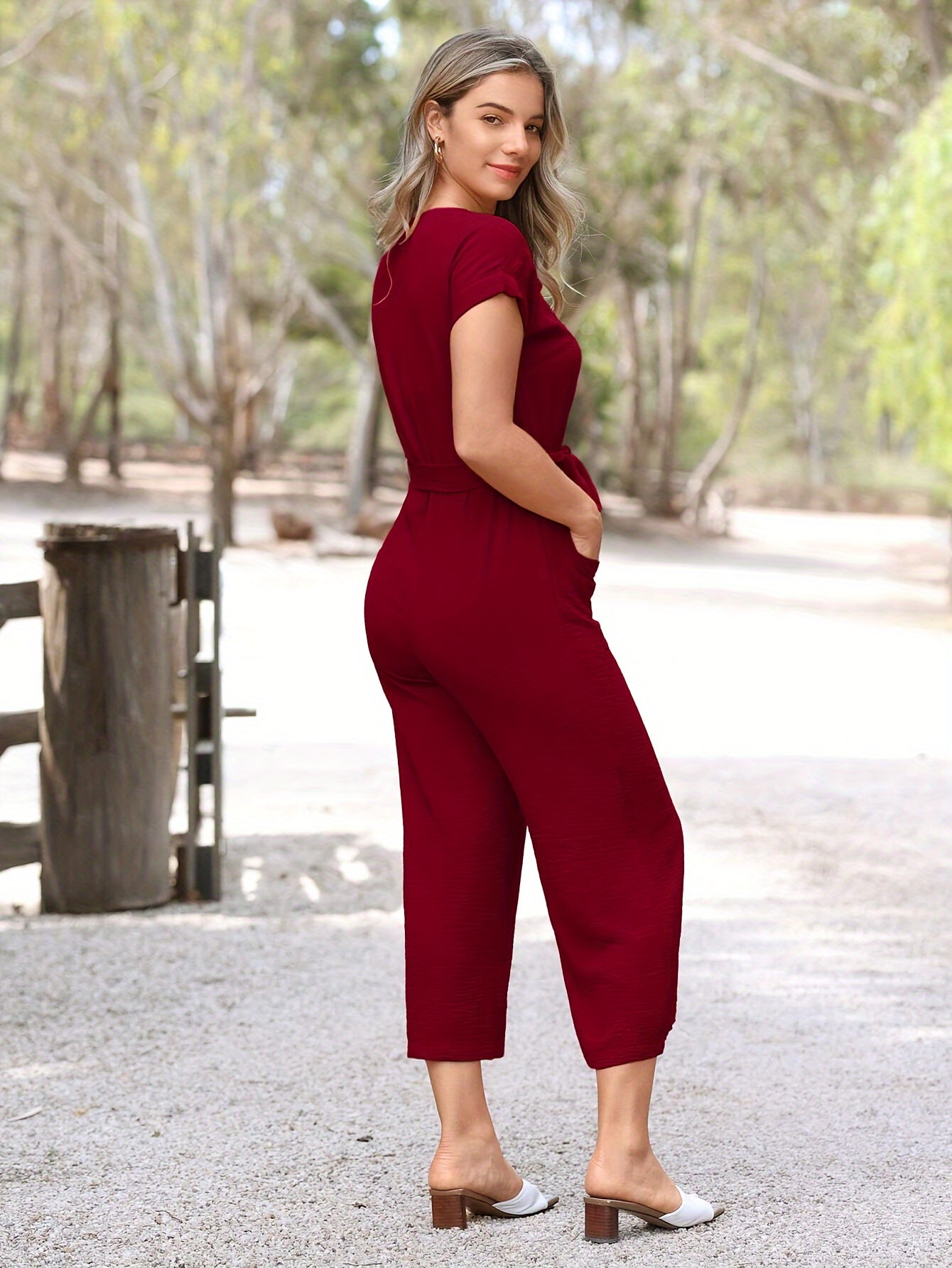 Blauwe jumpsuit met knoopsluiting en ceintuur - Emma